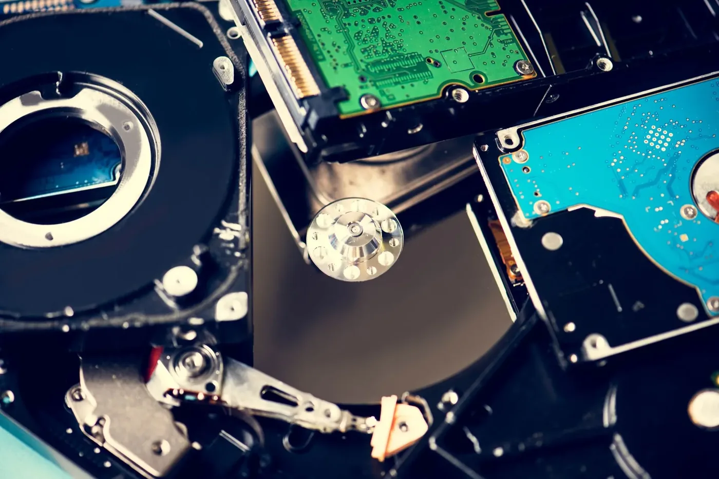 Opened hard drives showing platters and control boards